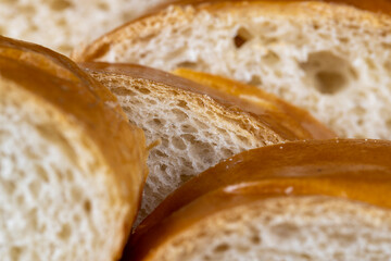 Wheat baguette on a wooden cutting board