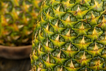 Ripe whole pineapple with green-yellow peel