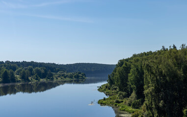 Fototapeta na wymiar Wide river in summer in sunny weather