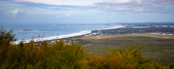 panorama of sunshine coast and coolum beach as seen from the top of mount coolum; aerial view of the coast of south east queensland, australia