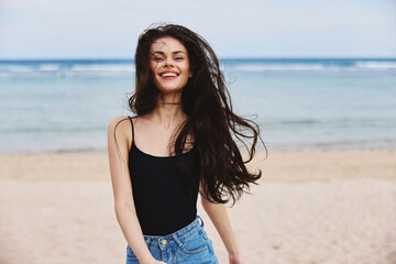 Fototapeta na wymiar vacation woman sunset young beach sea smile travel summer lifestyle running