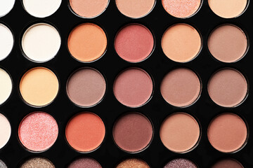 Beautiful eye shadow palette as background, top view