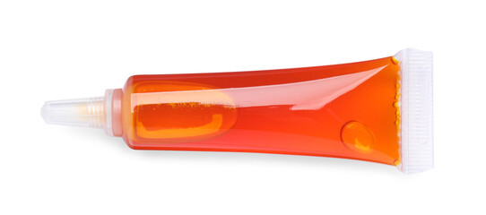 Tube with orange food coloring isolated on white, top view