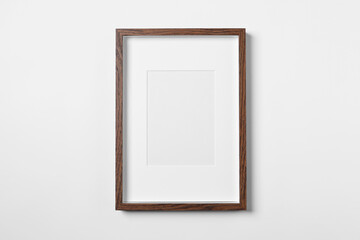 Empty wooden frame on white background. Mockup for design