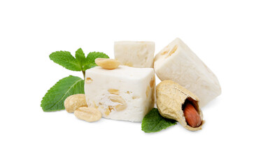 Pieces of delicious nougat, peanuts and mint on white background