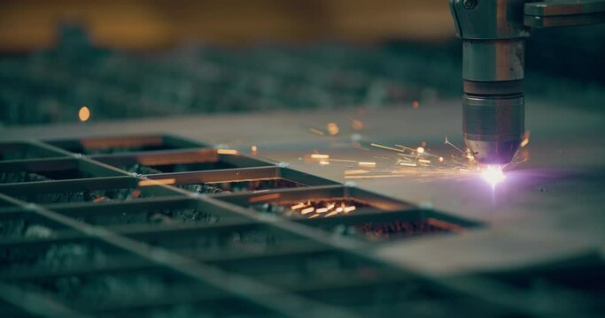 Plasma laser cutting metal sheet with sparks Welding