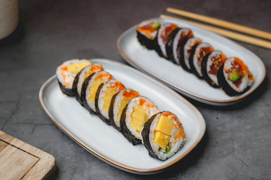 Sweet egg sushi roll or tamago roll. Japanese traditional food made from rice and seaweed.