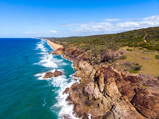 aerial view of beautiful beaches and cliffs at agnes water coast near the town of 1770 in gladstone region, queensland, australia; pristine beaches and unique sandy bays