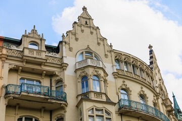 Obraz premium Facade of the house of classical European architecture of the old cozy tourist city. Background