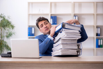 Young male employee working in the office