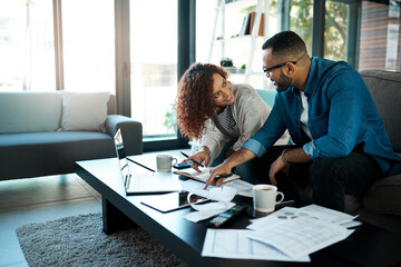Couple with budget planning, bills and accounting of home, people with notes to pay loan and...