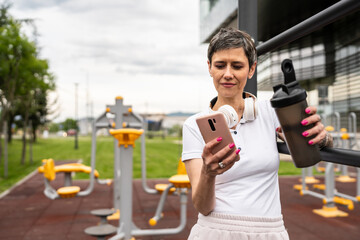 mature caucasian senior woman take a brake during outdoor training