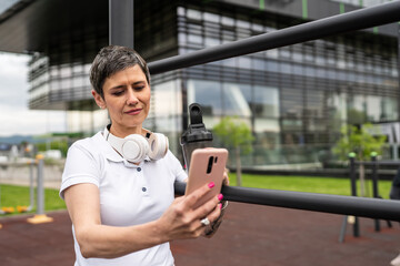 mature caucasian senior woman take a brake during outdoor training