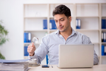 Young male employee working in the office