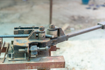 Close up bending metal rod.