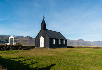 Fototapeta na wymiar Búðir, Iceland - View of Búðakirkja church on a sunny day