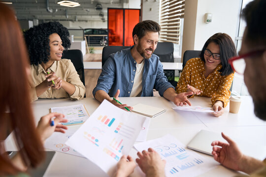 Group Of Smiling Multiracial Business People, Colleagues Talking, Planning Startup, Sharing Ideas Working Together In Modern Office. Meeting, Teamwork, Successful Business