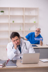 Fototapeta premium Two male doctors working in the clinic