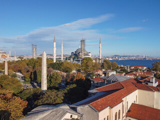 Fototapeta na wymiar Touristic sightseeing ships in Golden Horn bay of Istanbul and mosque view city