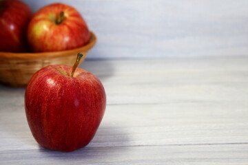 red apple fruit isolated on gray wooden background,selective focus with copy space
