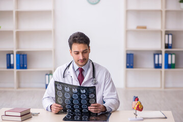 Young male doctor radiologist working in the clinic