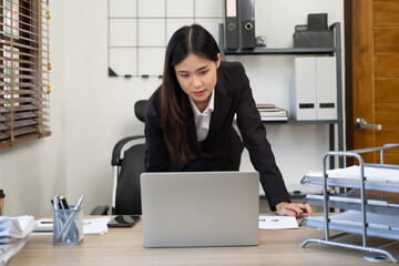 Portrait of Beautiful Asian Manager Using Desktop Computer, Businesswoman Managing Company Operations, Analysing Statistics, Commerce Data, Marketing Plans.