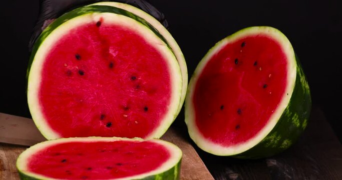Ripe red watermelon with black seeds, ripe and sweet red watermelon cut into pieces