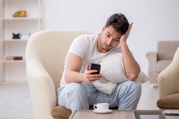 Fototapeta premium Young man starting day at home