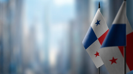 Small flags of the Panama on an abstract blurry background