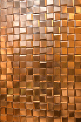 テクスチャ―　金色の凹凸のあるタイルの壁面texture of golden sqare tiles