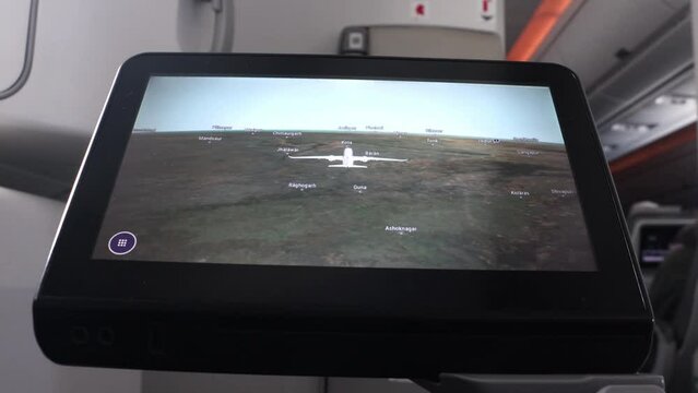 Route of flying plane on passenger monitor on a stand