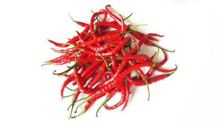 Cabai merah keriting or red hot chili peppers spicy blurred defocus isolated on white background
