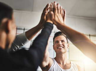 Success, teamwork and high five of people in gym for motivation, support and target. Workout,...