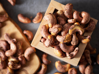 Roasted cashew nuts in a wooden bowl