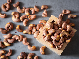 Roasted cashew nuts in a wooden bowl