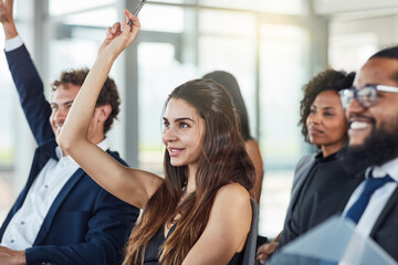 Business woman, hands raised and questions at conference, seminar or meeting. Smile, audience and...