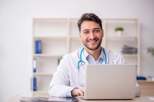 Young male doctor in telemedicine concept