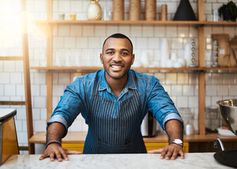 Coffee shop, counter and portrait of black man in restaurant for service, working and welcome in cafe. Small business owner, barista startup and happy male waiter smile in cafeteria ready to serve