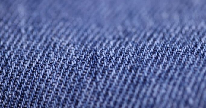 close-up of a new blue denim fabric, part of a pair of blue denim pants