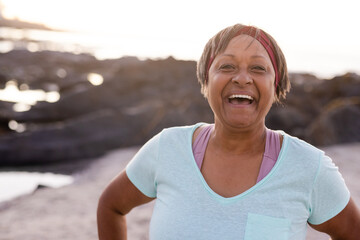 Portrait of happy senior african american woman at beach