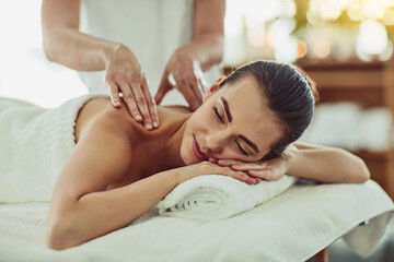 Relax, happy and massage with woman in spa for wellness, luxury and cosmetics treatment. Skincare, peace and zen with female customer and hands of therapist for physical therapy, salon and detox