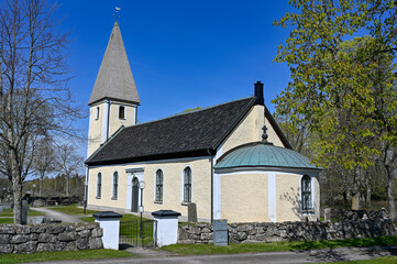 Fototapeta na wymiar Norrbyas church and blue sky near Orebro Sweden may 9 2023