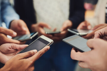 Business people, phone and hands in networking, social media or data sync together at office. Hand of group holding mobile smartphone for connection, communication or sharing information at workplace