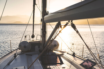 Yacht sailing at dawn