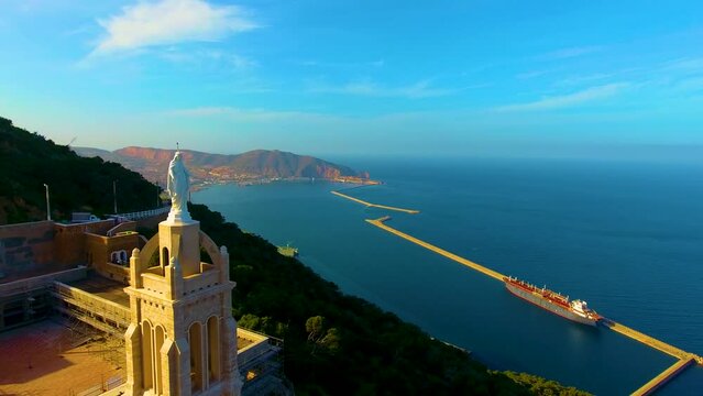 aerial shot of the santa cruz chapel at sunset with beautiful orange and blue colors and the sea in the background &ndash; LANDSCAPE