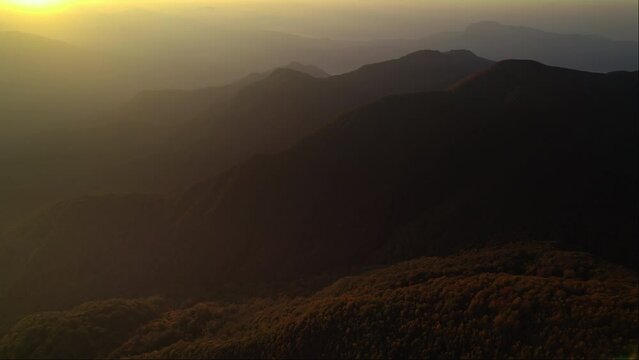 Sunrise vivid colorful aerial of dreamy mountains in the Cilento National Park Italy 4K drone