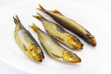 Delicious smoked fish on a white plate