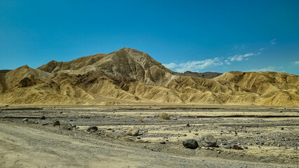 Scenic view of colorful geology of multi hued Amargosa Chaos rock formations in Death Valley National Park, Furnace Creek, California, USA. Barren desert landscape of Artist Palette in Black mountains