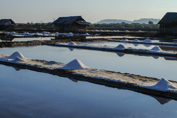 The process of crystallization of sea water into salt in the traditional way in Indonesia.