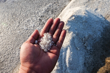 The process of crystallization of sea water into salt in the traditional way in Indonesia.